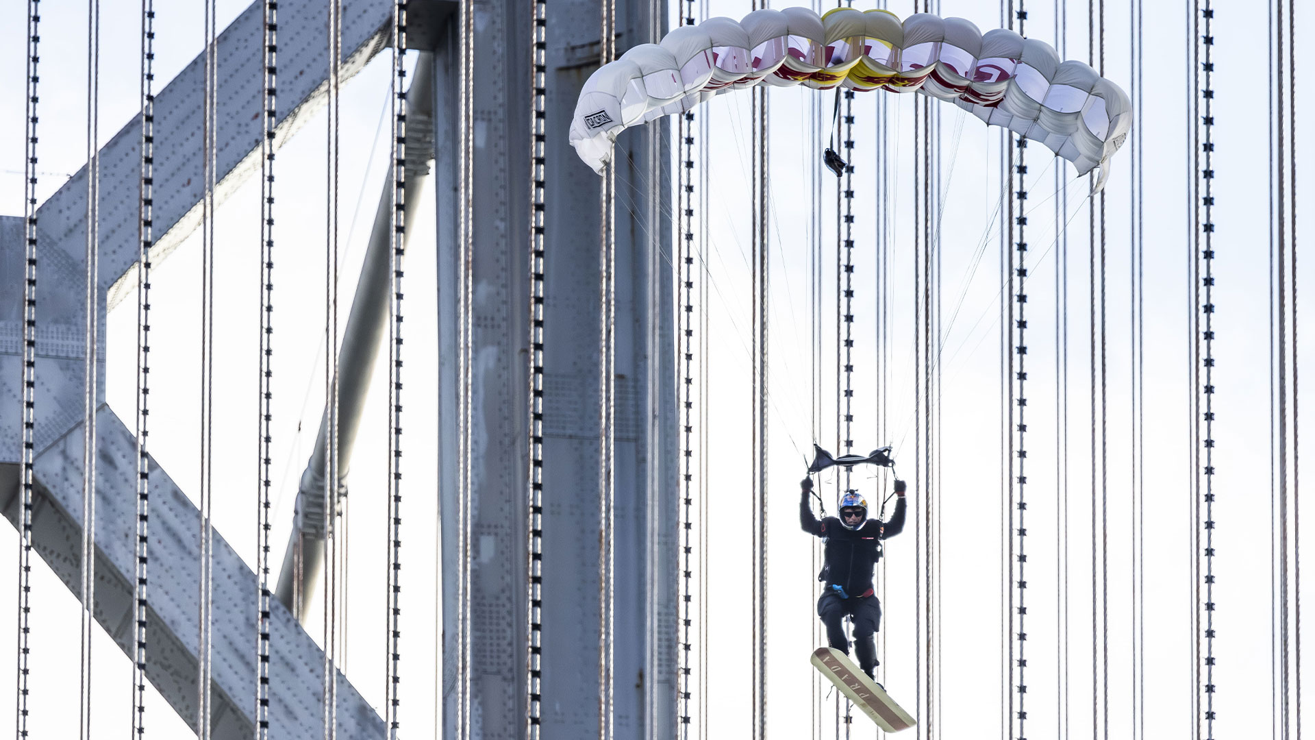 “Bridge Rider” Prada Linea Rossa and Red Bull help Sean MacCormac rewrite the history of skysurfing 